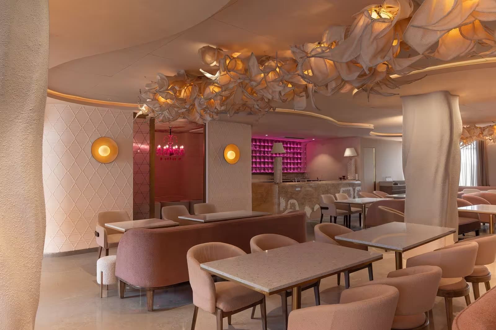 Cloud ceiling installation and dusty rose seating